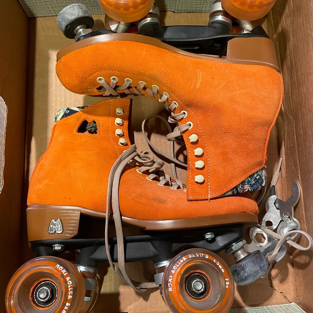 MOXI orange roller skates